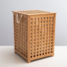 a small wooden basket sitting on top of a table