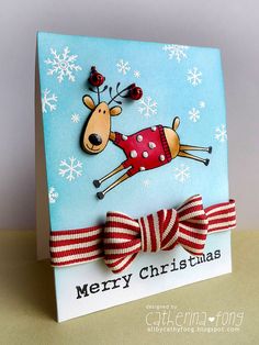 a christmas card with a reindeer wearing a red sweater and bow on it's head