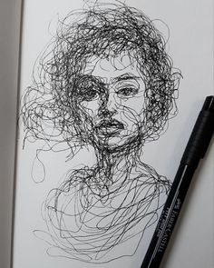 a black and white drawing of a woman's face