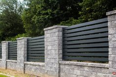 a row of stone blocks along the side of a road