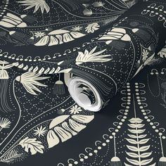 a black and white wallpaper with an intricate design on it's surface,