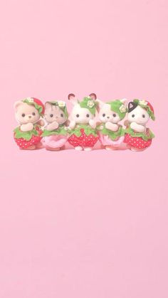 five little teddy bears sitting on top of each other in the shape of strawberrys