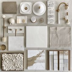 an assortment of white and gold bathroom accessories including soap, toothbrushes, toilet paper, napkins