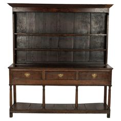 an old wooden desk with two drawers and shelves on it's sides, against a white background