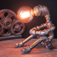 Industrial Nightstand Light: Metallic Silver Table Lighting Robot Pipe With Exposed Bulb Design Industrial Nightstand, Lampe Steampunk, Steampunk Table Lamp, Robot Lamp, Nightstand Light, Retro Table Lamps, Industrial Table Lamp, Table Lighting, Metal Lamp Shade