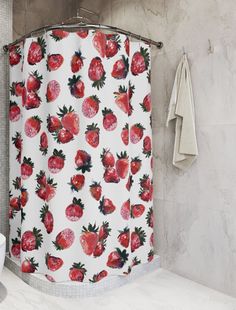 a shower curtain with strawberries printed on it