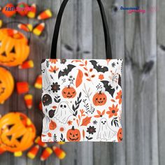 a trick or treat bag with pumpkins and bats on it