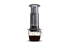 a coffee maker with liquid in it on a white background and the words aeropress above it