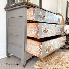 an old dresser has been painted with metallic paint