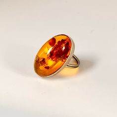 Gorgeous Vintage Artisan Boho Silver Oval Amber Crystal Gemstone Ring Size 5/6 1” From A Smoke Free And Pet Free Home Thank You For Checking Out My Closet! Save And Bundle! Fast Shipping! Generous Freebies In Every Order! All Reasonable Offers, Counteroffers And Negotiations Are Considered! Let Me Know If You Have Any Questions Or Would Like Measurements! Happy Poshing My Loves! Style: Boho Bohemian Hippie Western Rancher Coastal Cowgirl Cowboy Tribal Gypsy Aztec Fringe Hobo Blazer Jacket Peacoat Cardigan Sweater Chunky Knit Wool Blend Cozy Boutique Designer Vintage Art Deco Cruelty Free Vegan Organic Handmade Handcrafted Statement Jewelry Dainty Bib Necklac Handmade Bohemian Amber Rings, Orange Bohemian Jewelry With Cabochon, Bohemian Orange Metal Jewelry, Bohemian Orange Agate Jewelry, Cozy Boutique, Bohemian Carnelian Orange Jewelry, Wide Brim Straw Hat, Sweater Chunky, Hippie Rings