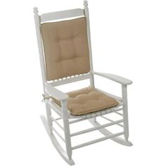 a white rocking chair with a tan cushion on the back and seat pad in front