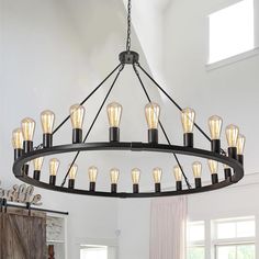 a large chandelier with many light bulbs hanging from it's center point