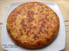 a pizza sitting on top of a white plate