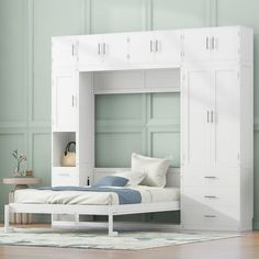 a white bunk bed with drawers underneath it