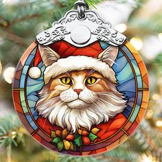 a stained glass ornament with a cat wearing a santa hat on it's head