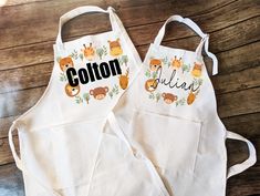 two personalized aprons with animals on them