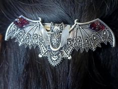 Whimsical Hand saudred stainless steel Bat hair pin. Featuring gorgeous detail in the bat pattern with added mini lumerian points, and garnet gemstone  this hair pin is on the heavier side so I'd recommend using it for thicker hair Vampire Fashion, Bat Jewelry, Outfit References, Alt Clothes, Bat Pattern, Reno Nv, Thicker Hair, Beautiful Clothes, Clothes Ideas