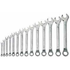 a bunch of wrenches are lined up in a row