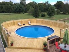 an above ground pool surrounded by wooden decking