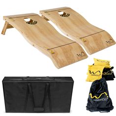 two wooden cornhole boards with carrying case and drawstring bag next to it