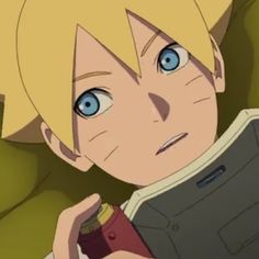 an anime character with blonde hair and blue eyes holding a cell phone in his hand