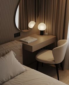 a bedroom with a bed, desk and chair in it next to a large round mirror