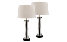 pair of modern chrome finish table lamps with white linen shades on each lamp and black base