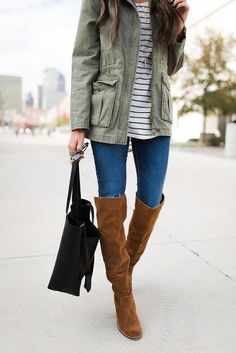 Street style | Striped shirt, jeans, khaki jacet and knee boots Army Boots Outfit Women, Green Army Jacket Outfit, Army Green Jacket Outfit, Army Jacket Outfit, Military Jacket Outfits, Brown Boot Outfits, Olive Military Jacket, Military Jacket Women