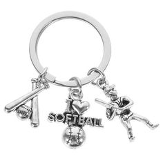 a keychain with two baseball players and the word softball on it, in silver