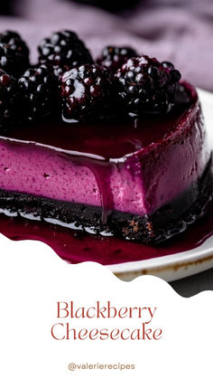 a slice of blackberry cheesecake on a white plate