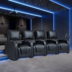 a row of black leather seats in front of a wall with blue lights on it