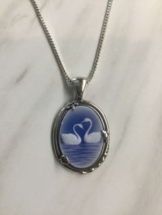 Blue agate swan cameo in a ocean setting Swan Locket, Swan Accessories, Blue Gem Necklace, Ocean Outfits, Two Swans, Swan Jewelry, Blue Jewellery, Swan Necklace, Pretty Jewelry Necklaces