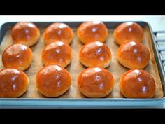 freshly baked buns on a baking sheet ready to go into the oven in the oven