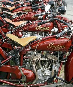 a row of motorcycles parked next to each other