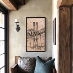 a living room filled with furniture and a painting hanging on the wall over a couch