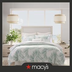 an advertisement for macy's bedding with palm leaves on it