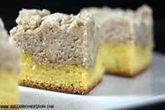 three pieces of yellow cake sitting on top of a white plate next to each other