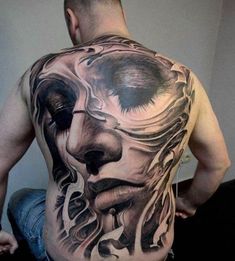 a man with a tattoo on his back