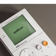 an electronic device with the word braunn on it's screen and two buttons