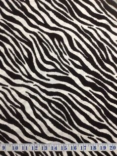 a zebra print fabric with black and white stripes