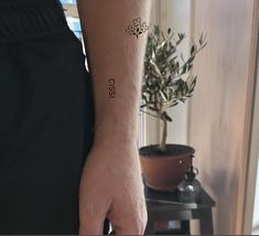 a person with a small tattoo on their arm