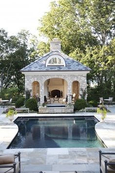 a pool with a gazebo next to it