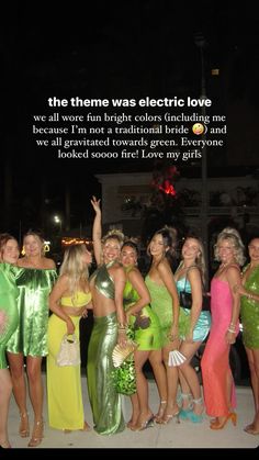 a group of women standing next to each other in front of a sign that says, the theme was electric love