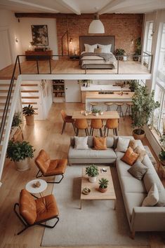 an overhead view of a living room with couches, chairs and tables in it