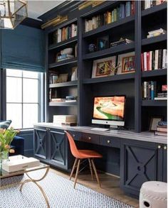 a living room filled with furniture and bookshelves