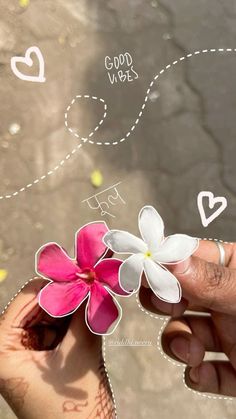 a person holding a flower in their hand with words written on the side of it