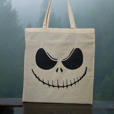 a trick or treat bag with a jack skellingy face on it