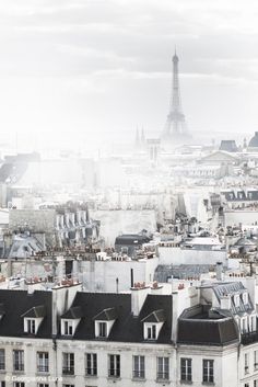 the eiffel tower towering over paris, france with text reading packing for paris