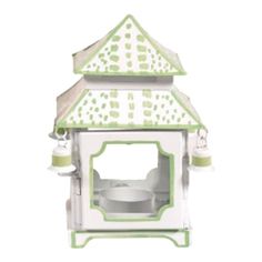 a white and green bird house on a white background