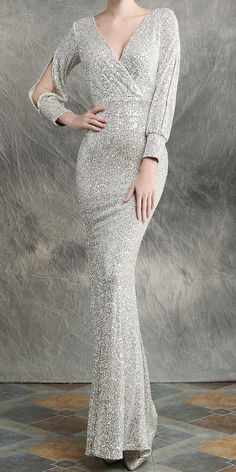 $94.90 - Stunning Sequin Sparkle Light Silver Gray Evening Maxi Dress With Long Sleeves For Elegant Ladies and classy women. This mermaid fishtail dress is bodycon tight fitted with v-neck. Perfect for formal dinners, cocktail party, bridesmaid, prom and evening. #silverdress The fabric is THICK, SOFT and STRETCHABLE. It will fit you well. We do not see through. Our online boutique offers FREE RETURNS, free size exchange and worldwide free shipping. Silver Dresses Elegant, Silver Evening Gown, Shiny Silver Dress, Silver Evening Gowns, Maxi Dress With Long Sleeves, Long Sequin Dress, Dresses Traditional